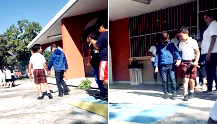 Niño ayuda a su mejor amigo invidente tomándolo de la mano